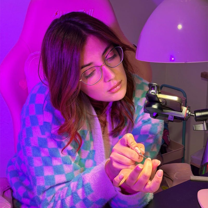 Professional nail artist working on advanced nail techniques during Planet Nails Art online training program in Italy